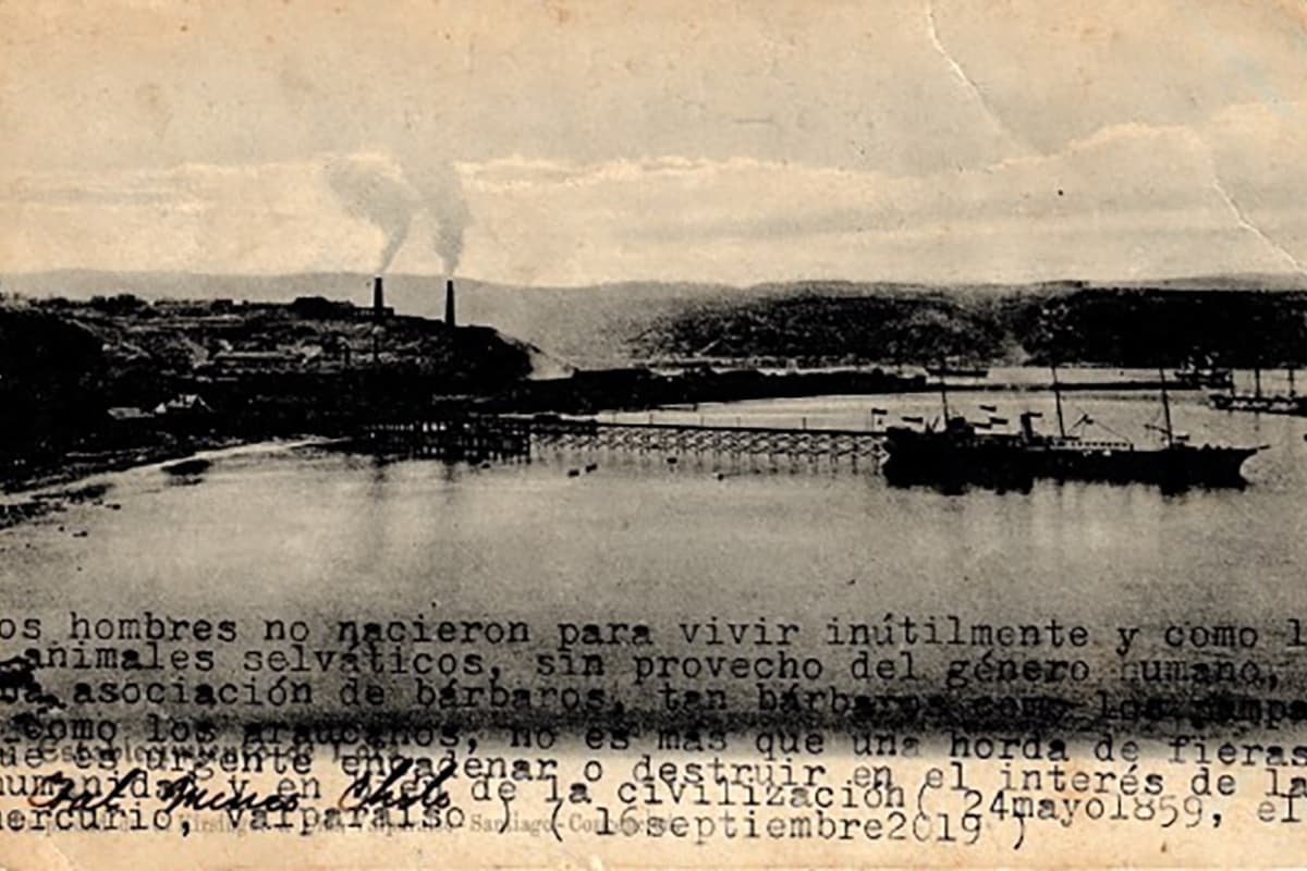 A faded postcard of what looks like a small shipping port with smokestacks in the background. The postcard has been overtyped with a typewriter.