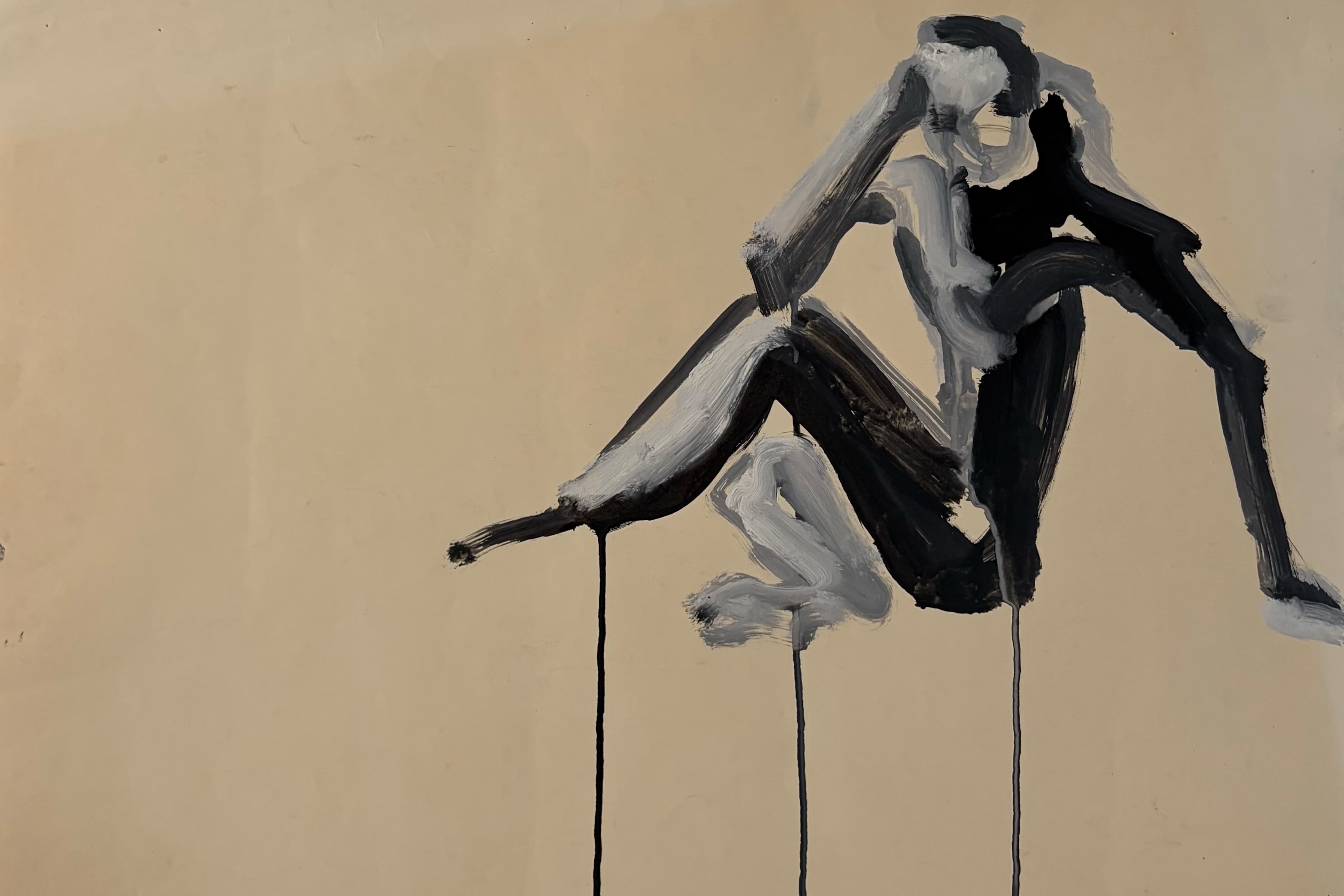 An abstract painting depicting a seated human figure rendered in broad black and white brushstrokes against a plain beige background, featuring three thin vertical dripping lines emanating from the figure down the painting.
