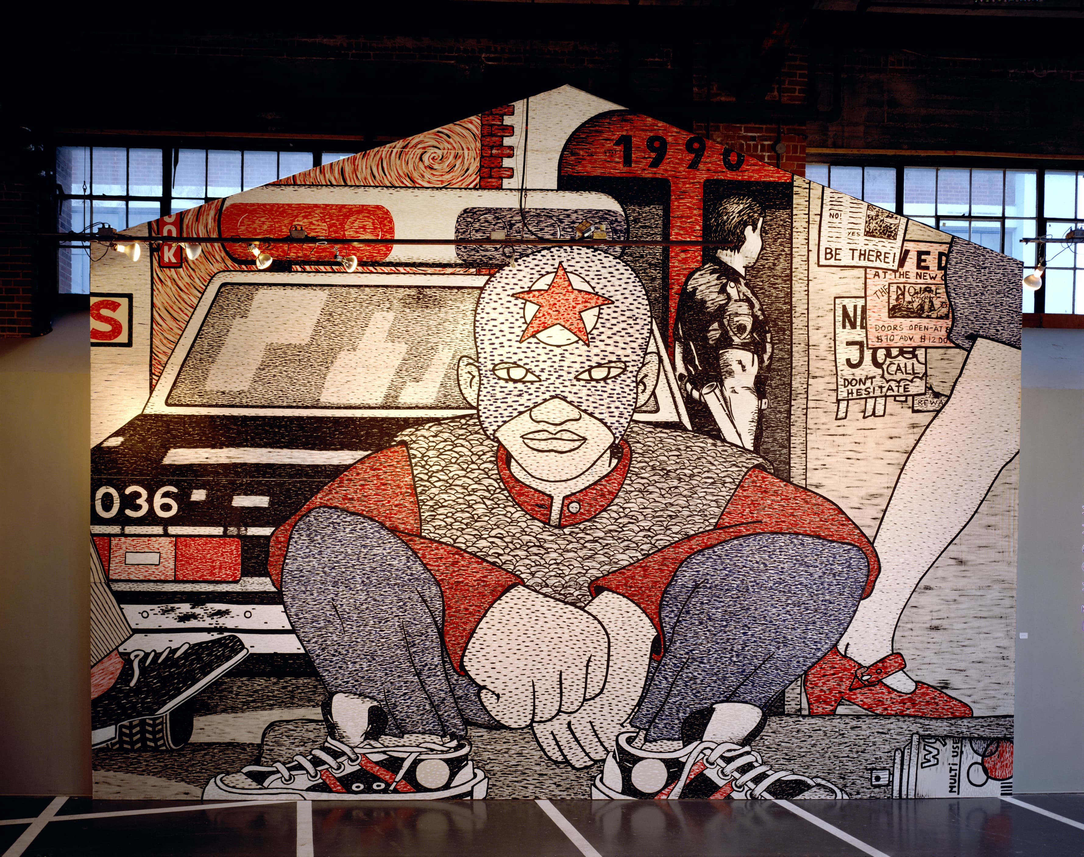 Mural portraying in the center a kid facing front while wearing a Captain America costume while kneeling. A glimpse of a graffitti spray can lays on the floor to the right of the kid. In the back, the back of a police car, next to it an officer looking at flyers. In between them, a couple of legs and shoes from pedestrians can be seen as they walk what seems like a sidewalk. Colors used are black, blue, red, and white.