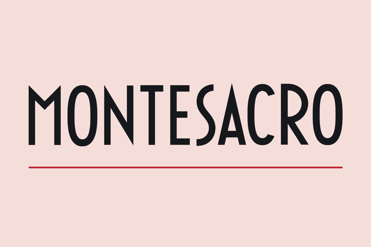 The Montesacro logo displays the word “Montesacro” in tall, bold black lettering centered on a pale pink background, with a thin horizontal red line positioned below the text.