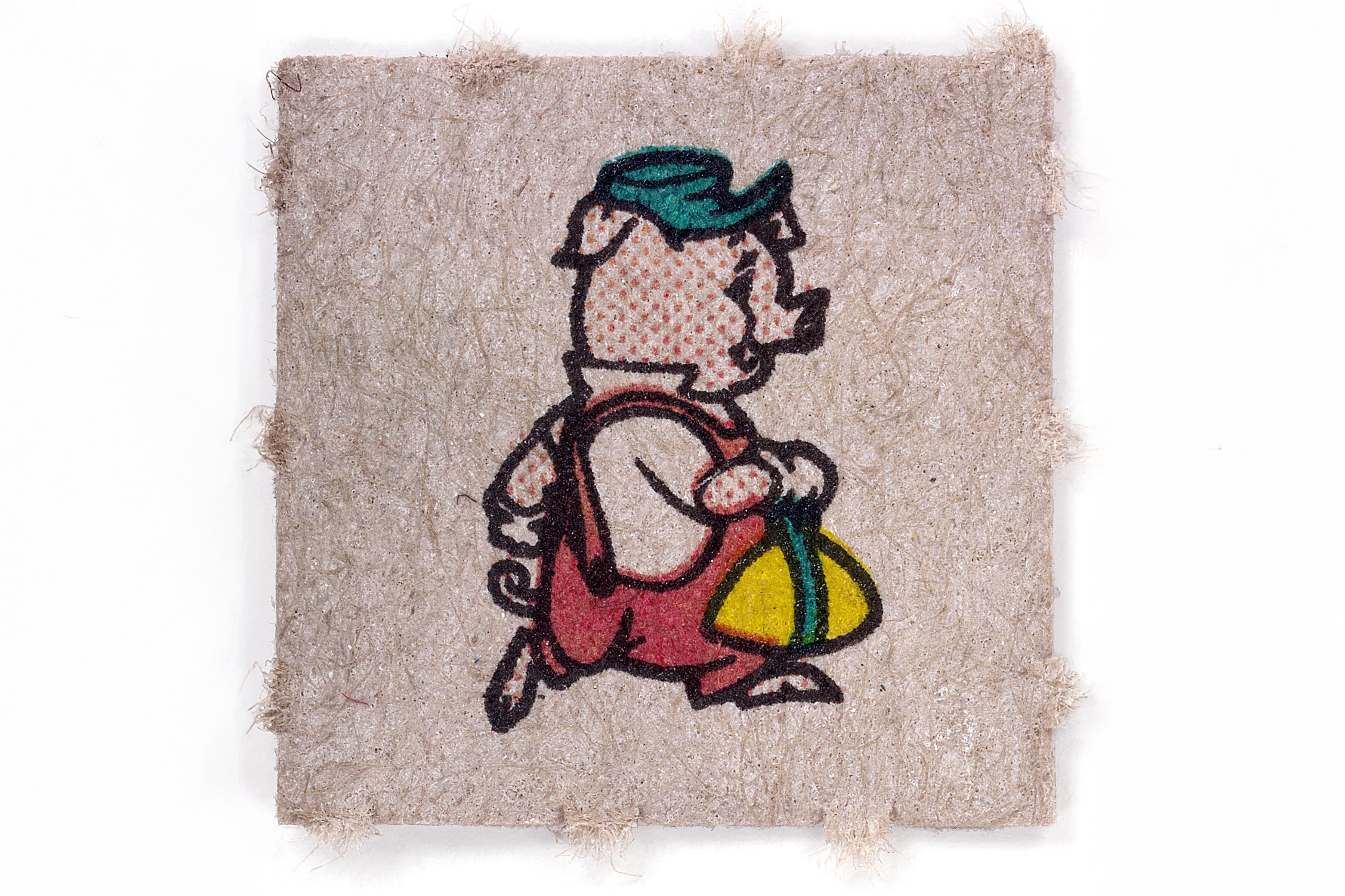 A single square of fibrous, textured tan blotter paper featuring a vintage-style cartoon illustration of a pig walking. The pig wears a green cap and red overalls while carrying a yellow and green bag.