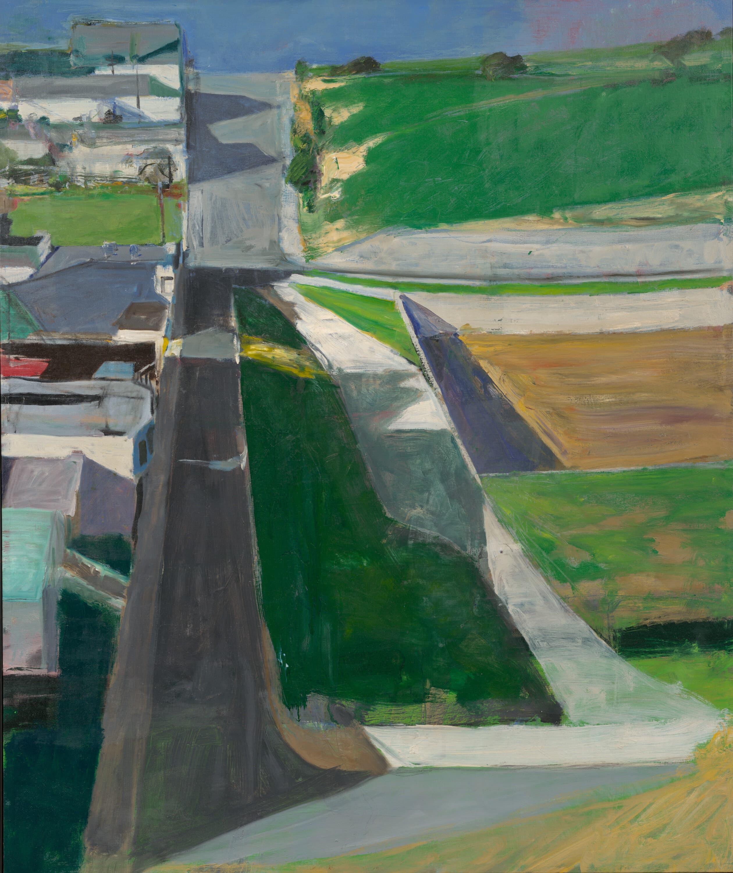 The artwork features a highly stylized, birds-eye view of a suburban California hillside landscape, rendered in a style that bridges representation and geometric abstraction. The composition is split vertically into distinct zones: on the left, a dense block of geometric, neutral-colored houses and buildings extends alongside a dark, vertical roadway slicing down the canvas. The right side features bold, layered geometric fields of deep green grass, light gray concrete sidewalks, and bands of ochre and tan soil. The steep perspective gives the landscape a flattened, grid-like plane.