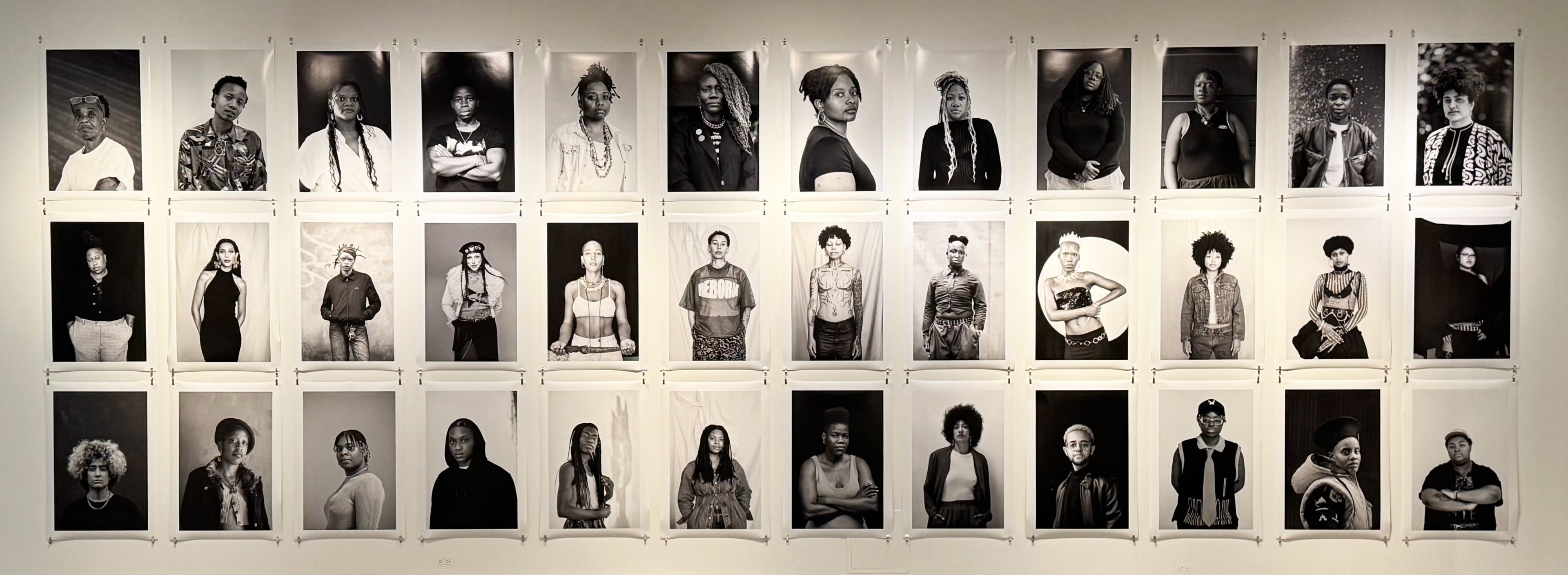 36 black and white portraits by Zanele Muholi arranged in a grid of 3 rows and 12 columns.