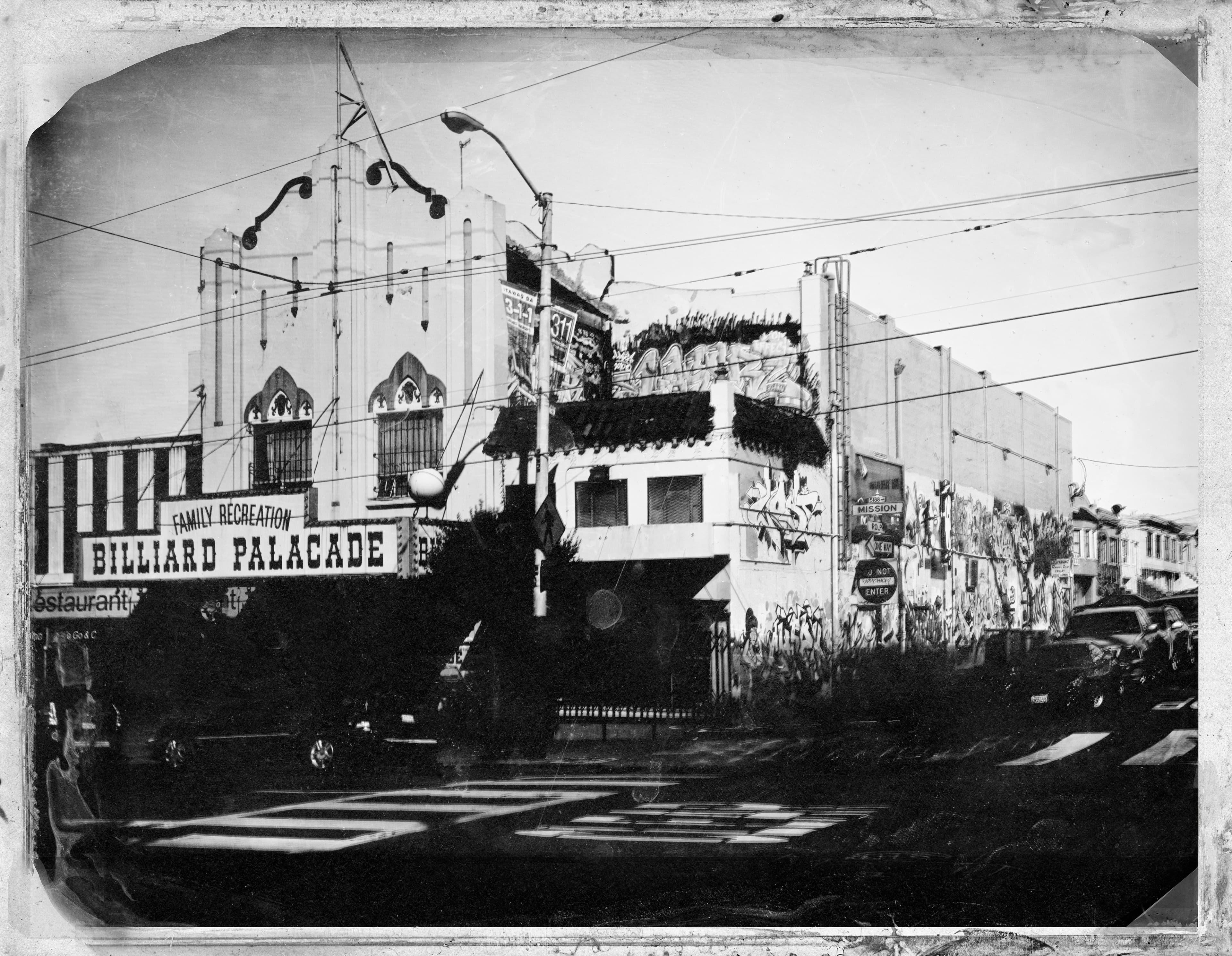 Black and white image of the exterior of a building in San Francisco. The sign reads "Family Recreation Billiard Palacade".