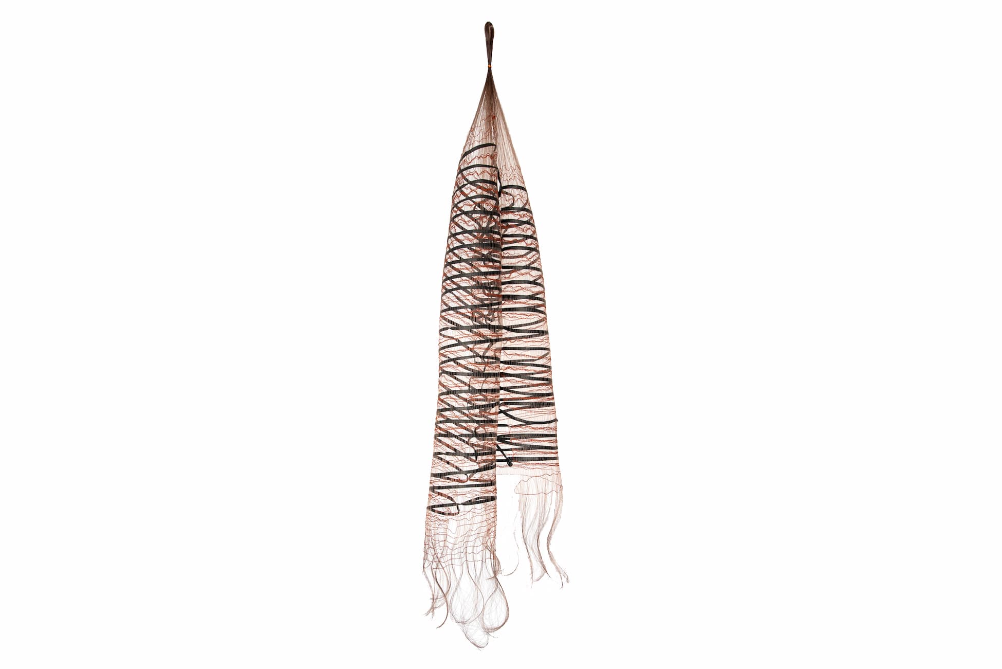 Threads of monofilament, paper strands, and wool fibers are woven delicately into a vertical tube.