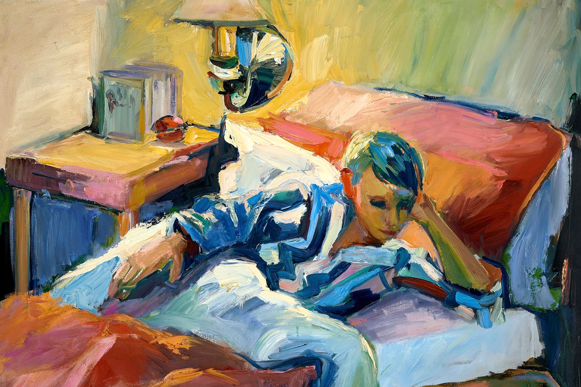 With gestural brushwork, Goldbrick depicts a cozy scene with a young boy in blue-striped pajamas, nestled in bed under red sheets. To the left of the bed, there is a wooden bedside table with books and a wall sconce creating a light yellow glow. A signature reading “H. Berk” sits in the bottom right corner